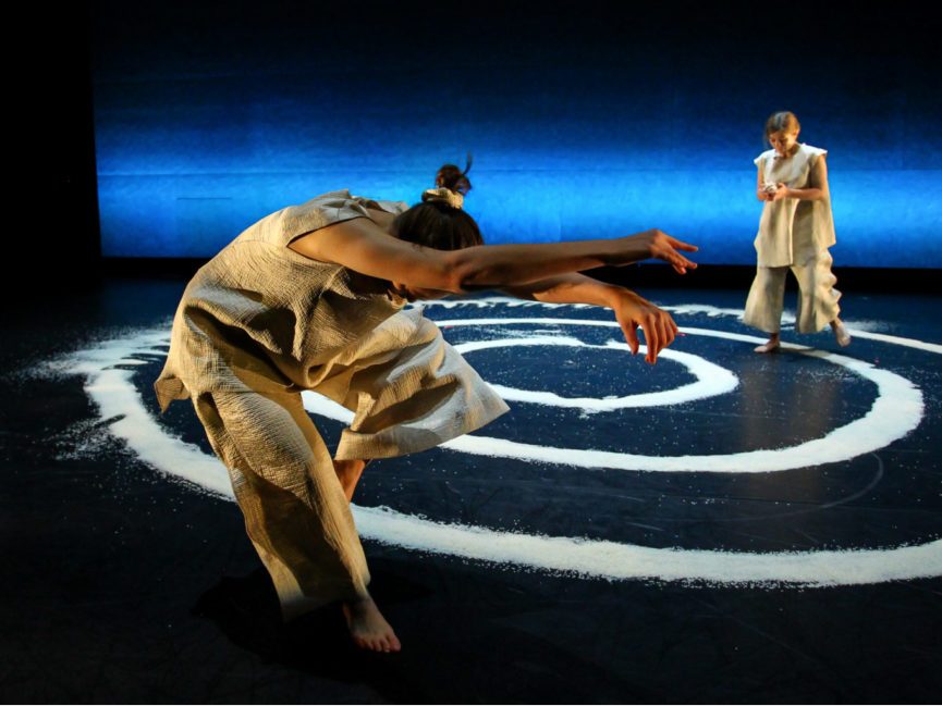 student dancers with rice onstage