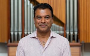 rudresh in front of organ