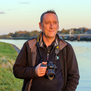anthony murphy with camera by sea
