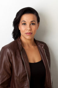 anya pearson in brown leather jacket