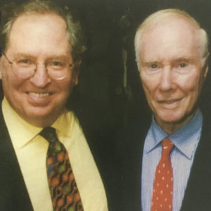 Photo of 2 men looking into the camera
