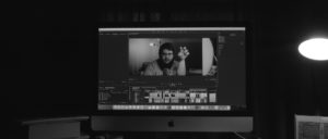 iMac computer screen shows film editing software
