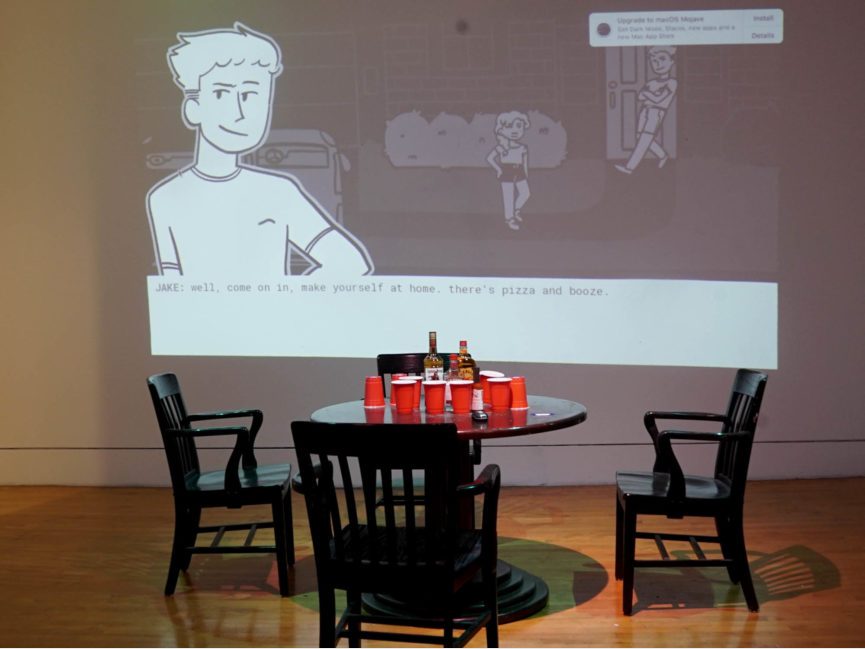 A projection appears on a wall in front of a table covered in red cups and bottle of liquor.