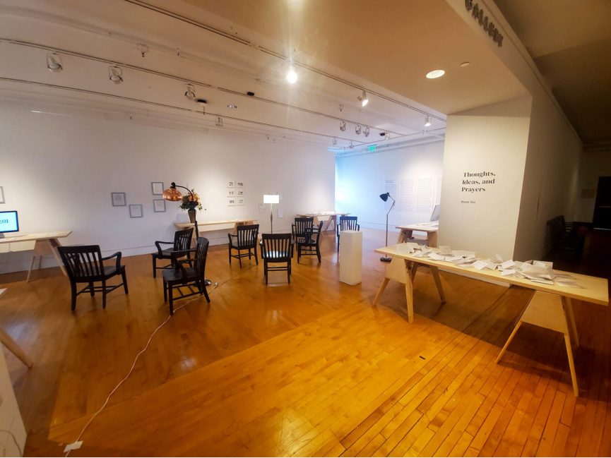 Tables and chairs in a gallery space