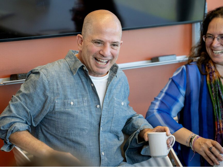 Alumnus David Zabel smiles as he talks to students