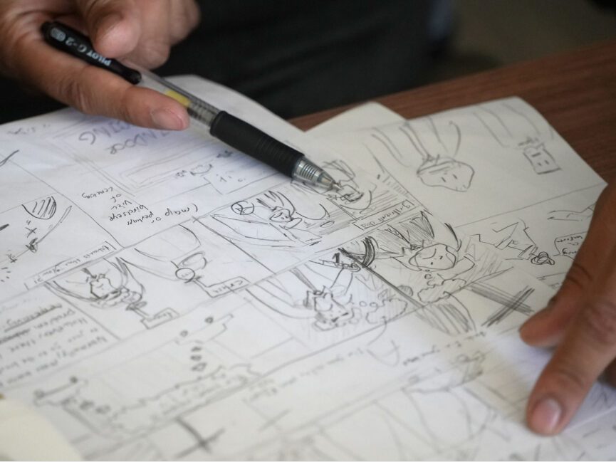 A student draws in a sketch pad