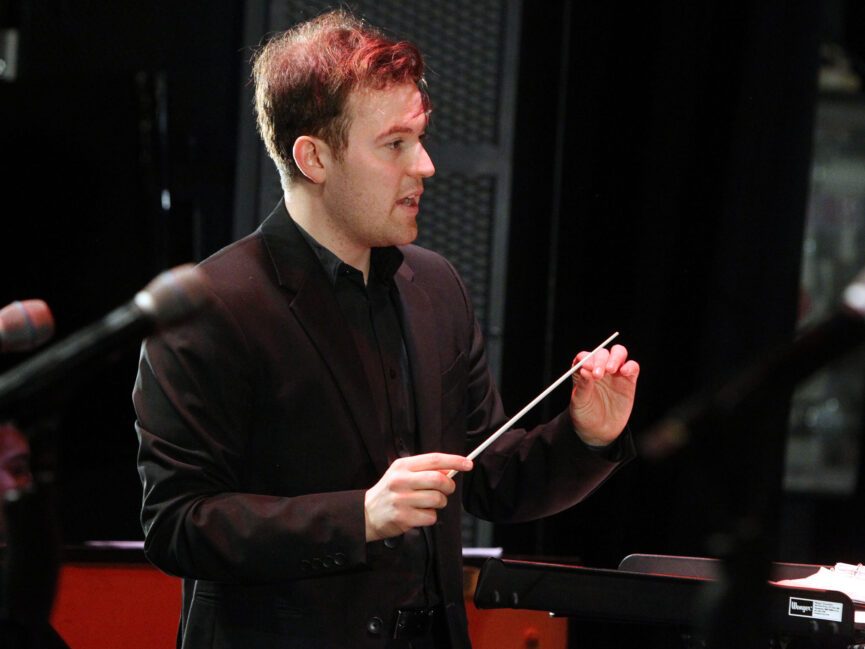A music director conducts