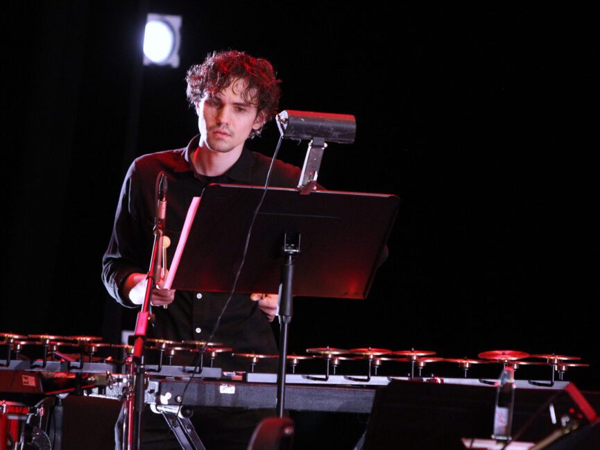 A musician plays a percussion instrument