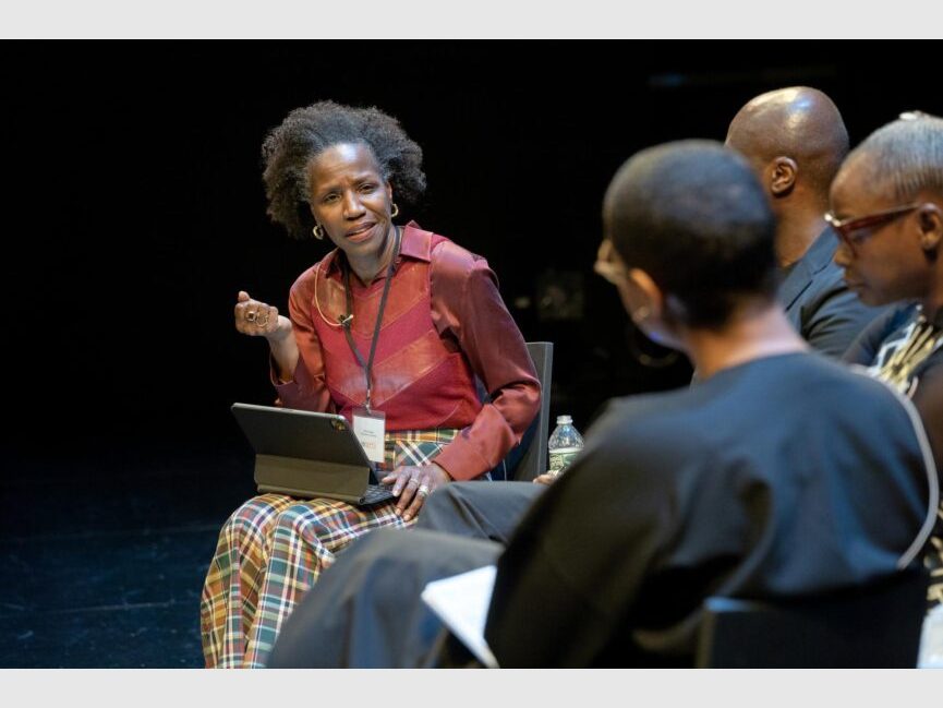 Tina Campt gestures and addresses fellow panelists.