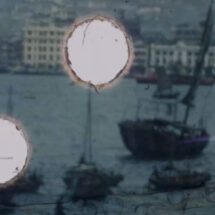 A scene of boats sailing on water with a cityscape in the background, interrupted by large white circles.