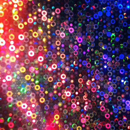 Tons of small colorful circles scattered in an abstract way.