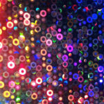 Tons of small colorful circles scattered in an abstract way.